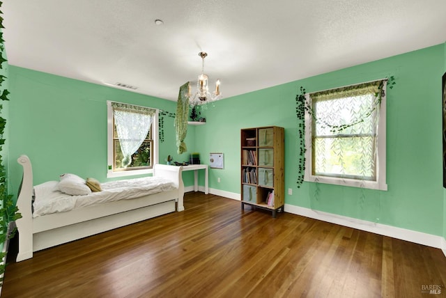 151 Randolph St, Napa, CA 94559 - bedroom with a chandelier, baseboards, visible vents, and hardwood / wood-style floors