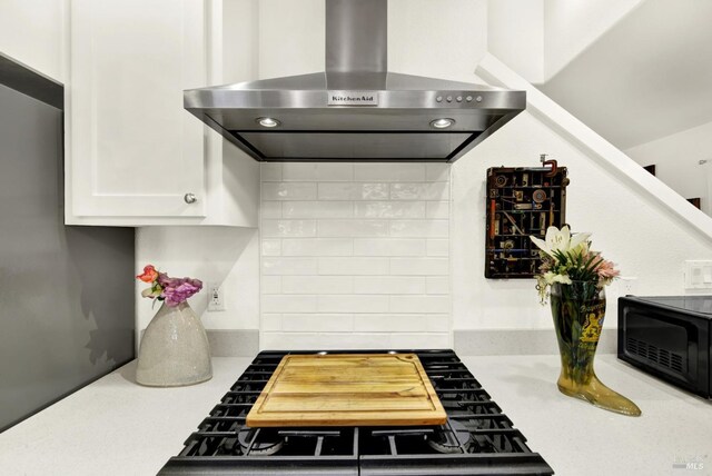 151 Randolph St, Napa, CA 94559 - kitchen with backsplash, light countertops, white cabinets, and wall chimney exhaust hood