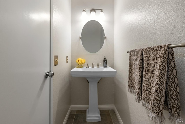 bathroom featuring tile patterned floors and baseboards