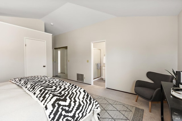bedroom with vaulted ceiling, light colored carpet, and visible vents
