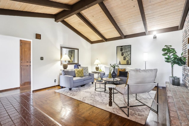 living area with baseboards, lofted ceiling with beams, and wood ceiling