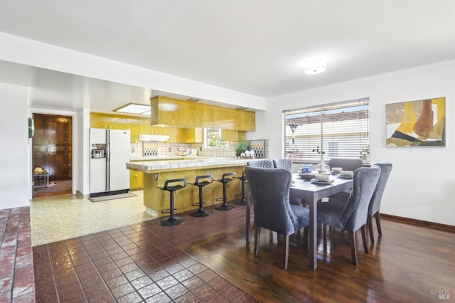 dining space featuring baseboards