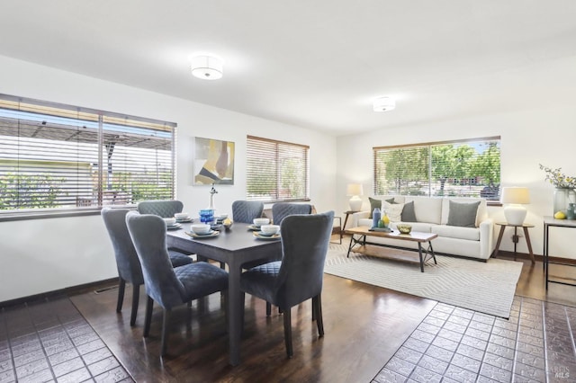dining area featuring baseboards