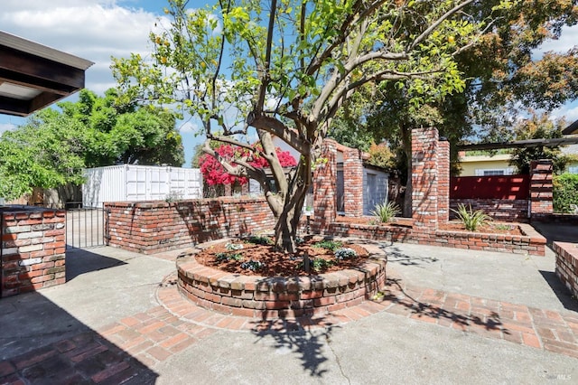 view of patio / terrace with a gate and fence