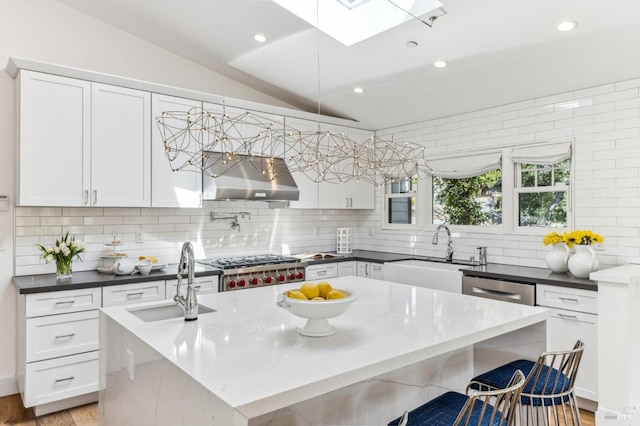 30 Corte Sereno, Greenbrae, CA 94904 - kitchen with a sink, range hood, a skylight, lofted ceiling, and decorative backsplash