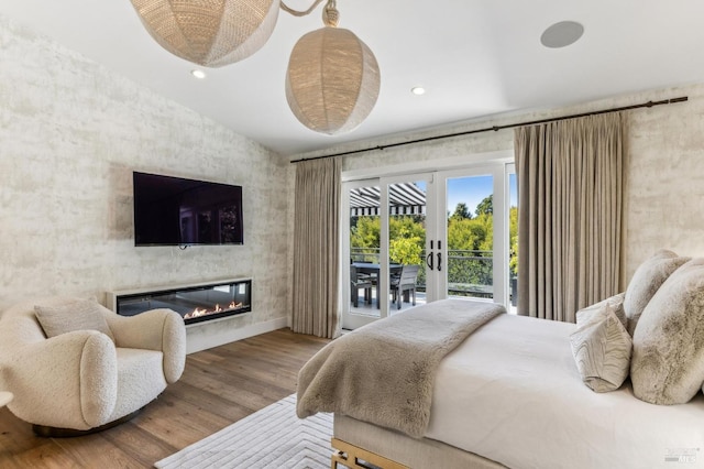 30 Corte Sereno, Greenbrae, CA 94904 - bedroom featuring access to outside, wood finished floors, a glass covered fireplace, recessed lighting, and baseboards