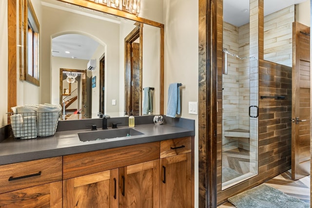 full bathroom with vanity, a wall mounted AC, a stall shower, and a sauna