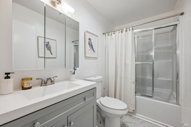 bathroom featuring vanity, marble finish floor, toilet, and shower / tub combo