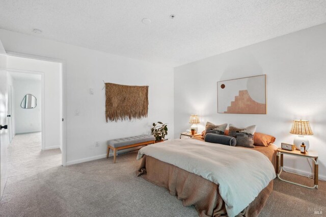 carpeted bedroom with baseboards