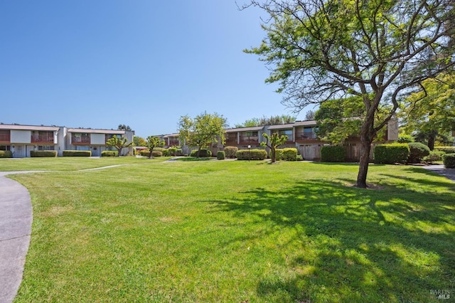 view of home's community featuring a yard