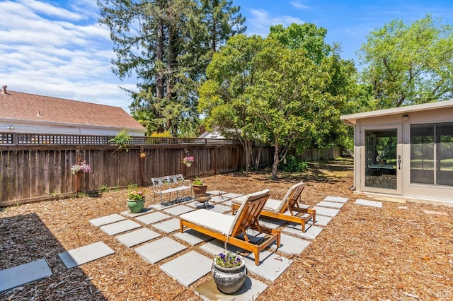 view of yard with a fenced backyard and a patio area
