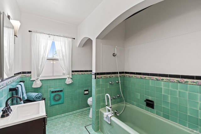 1722 Elm St, Napa, CA 94559 - full bath with tile walls, a wainscoted wall, vanity, toilet, and tile patterned flooring