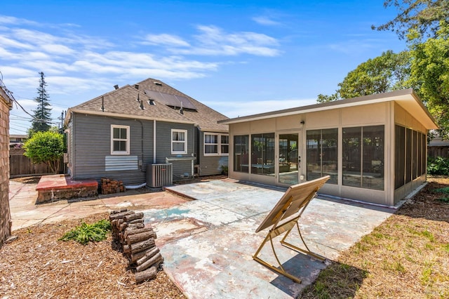 1722 Elm St, Napa, CA 94559 - back of house with a sunroom, a patio, a shingled roof, and roof mounted solar panels