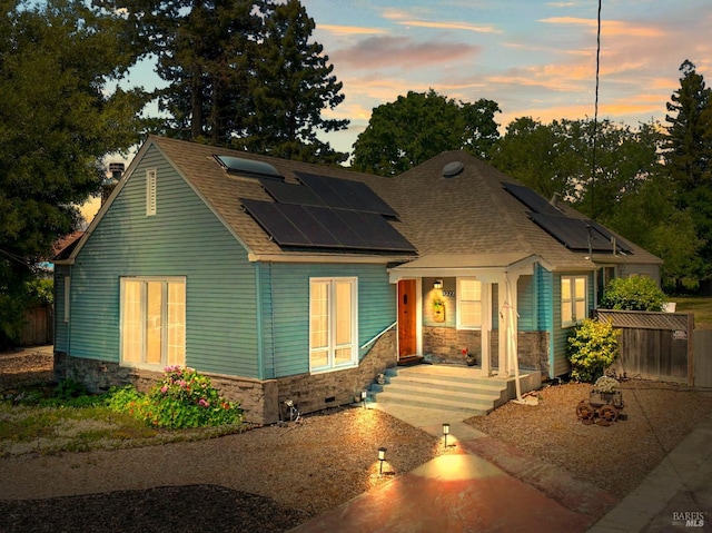 1722 Elm St, Napa, CA 94559 - view of front of property with a porch, fence, solar panels, and stone siding