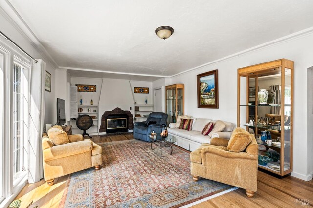 1722 Elm St, Napa, CA 94559 - living area featuring wood finished floors, a glass covered fireplace, and crown molding
