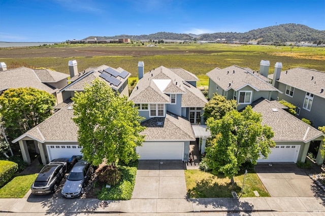 birds eye view of property with a residential view and a mountain view