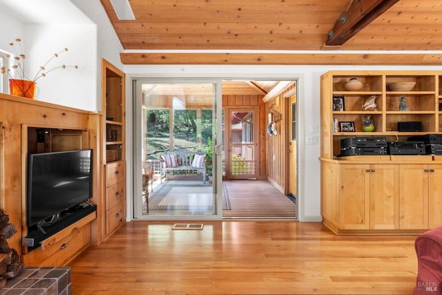 living room with wood ceiling, beamed ceiling, light wood-type flooring, and visible vents