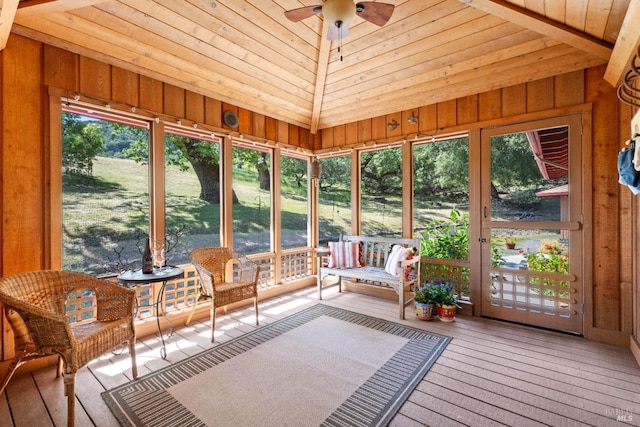 sunroom / solarium with a ceiling fan