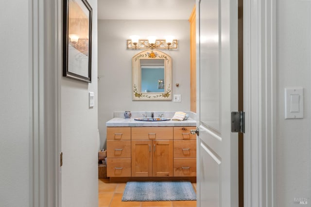 bathroom with tile patterned flooring and vanity