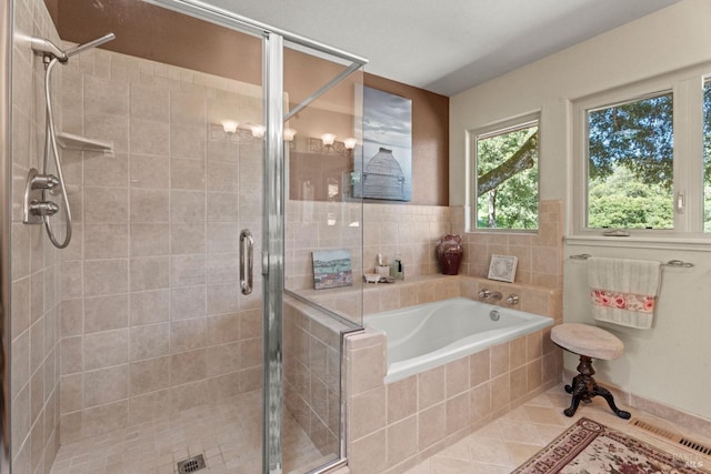 full bath featuring tile patterned floors, visible vents, a bath, and a stall shower