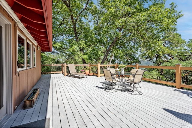 wooden deck with outdoor dining space