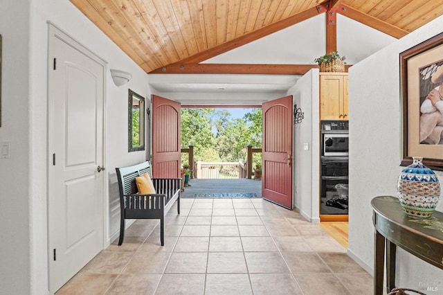 interior space featuring light tile patterned floors, wood ceiling, vaulted ceiling with beams, and baseboards