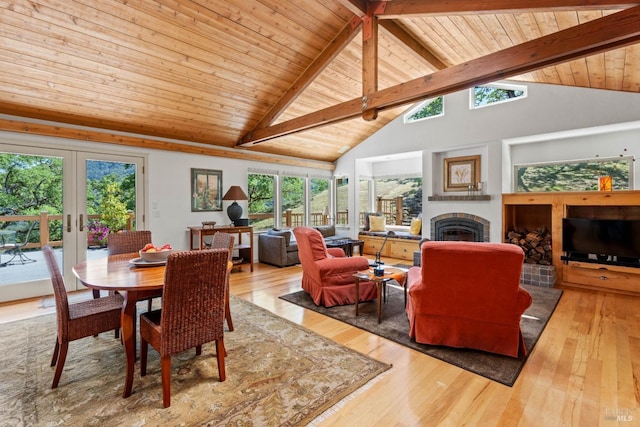 dining area featuring plenty of natural light, hardwood / wood-style flooring, and a fireplace