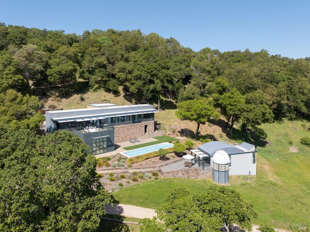 aerial view with a wooded view