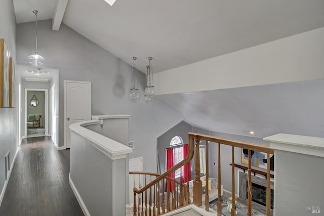 staircase with visible vents, wood finished floors, beamed ceiling, baseboards, and high vaulted ceiling