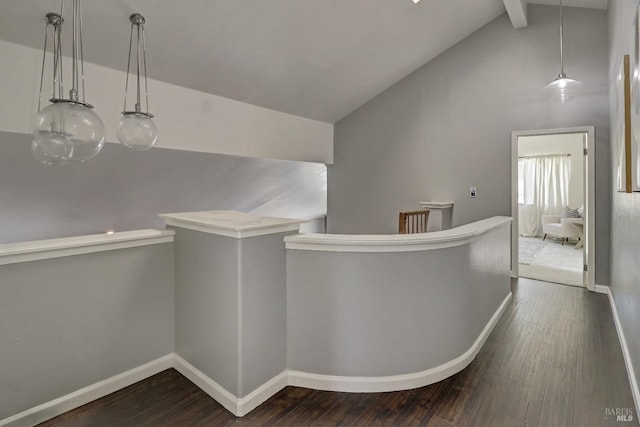 corridor featuring baseboards, lofted ceiling with beams, dark wood-style flooring, and an upstairs landing