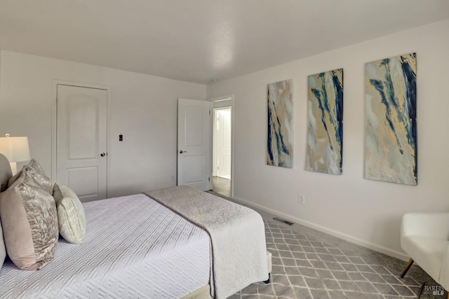 carpeted bedroom with baseboards