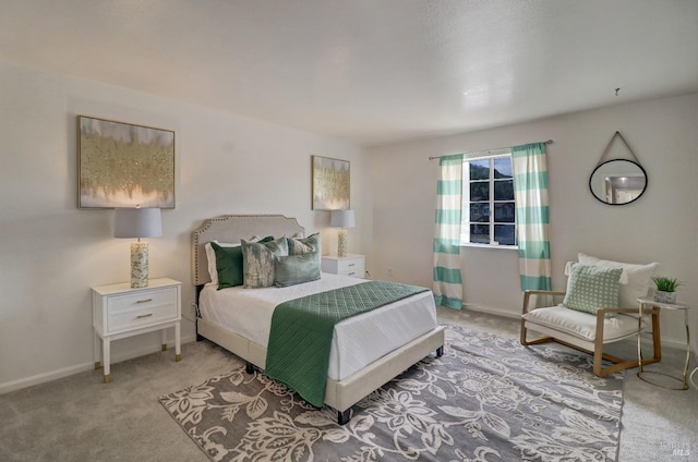 carpeted bedroom with baseboards