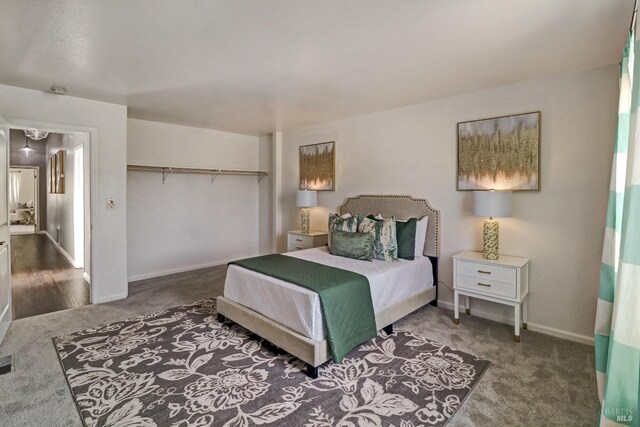 bedroom featuring baseboards, carpet, a closet, and visible vents