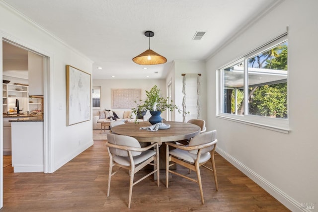 16 Tradewind Psge, Corte Madera, CA 94925 - dining room featuring crown molding, baseboards, wood finished floors, and visible vents