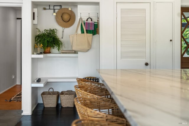mudroom with wood finished floors