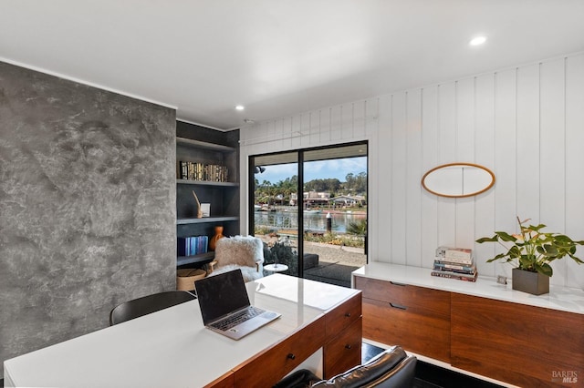 office with a water view and recessed lighting