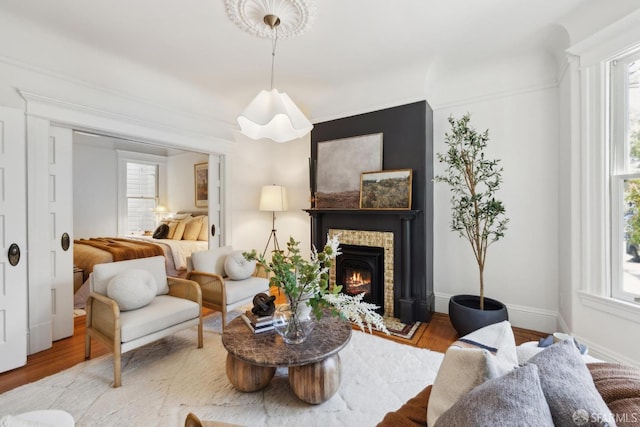 62 Walter St, San Francisco, CA 94114 - living area featuring a brick fireplace, baseboards, plenty of natural light, and wood finished floors