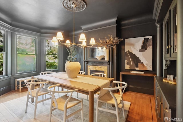 62 Walter St, San Francisco, CA 94114 - dining room featuring a notable chandelier, a healthy amount of sunlight, and light wood-style flooring