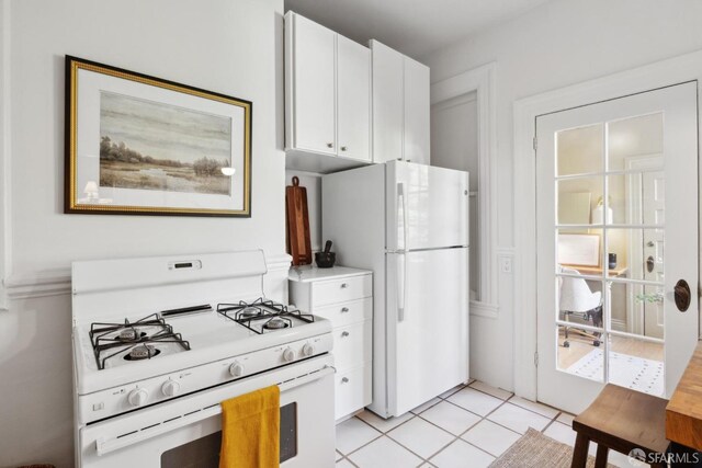 62 Walter St, San Francisco, CA 94114 - kitchen featuring light tile patterned floors, light countertops, white cabinets, and white appliances