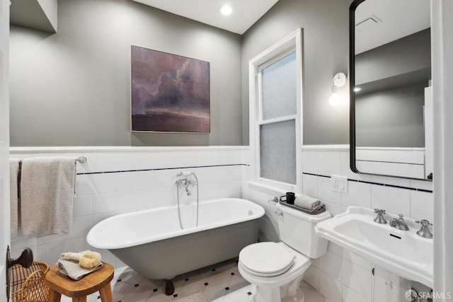 62 Walter St, San Francisco, CA 94114 - full bathroom with tile walls, toilet, a freestanding tub, and a sink