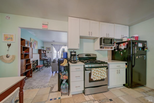 1812 Utah St, Fairfield, CA 94533 - kitchen with stainless steel appliances, light countertops, white cabinetry, and open floor plan