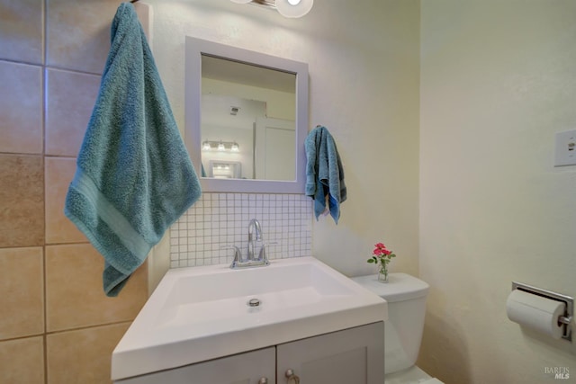 1812 Utah St, Fairfield, CA 94533 - bathroom featuring vanity, toilet, and decorative backsplash