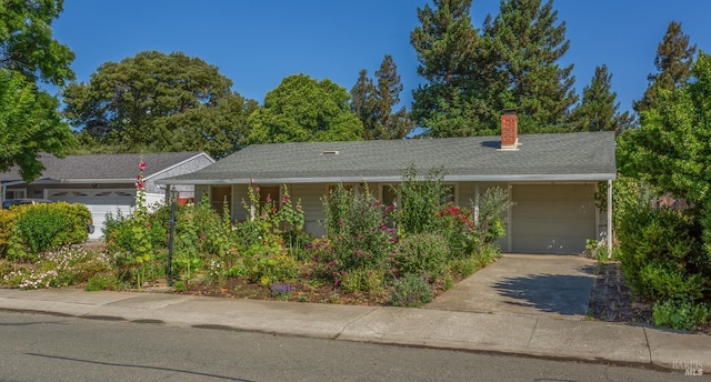 1812 Utah St, Fairfield, CA 94533 - view of front of home with a garage, driveway, and a chimney