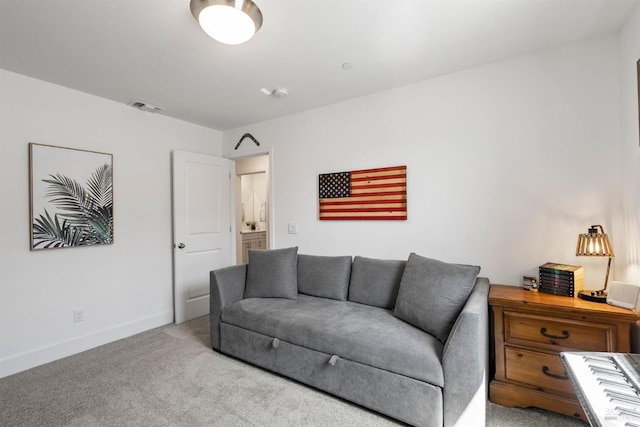 carpeted living room featuring baseboards and visible vents