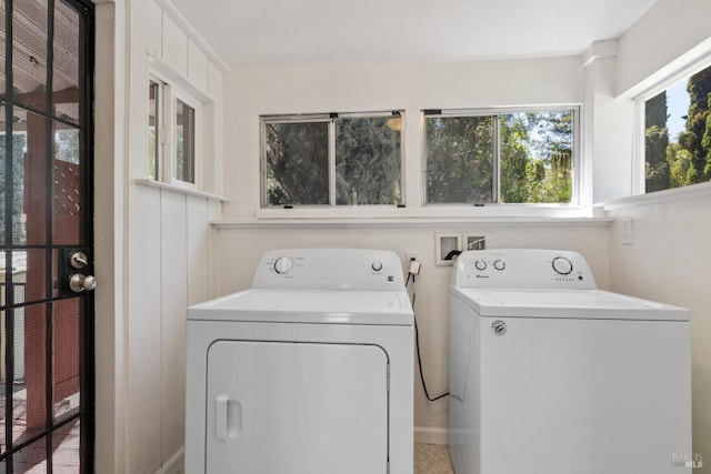 washroom featuring laundry area and washer and dryer