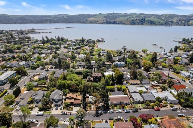 aerial view featuring a residential view and a water and mountain view