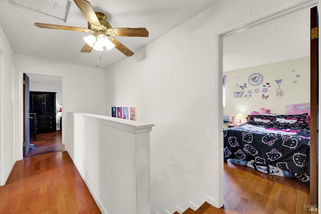 954 Coventry Ln, Fairfield, CA 94533 - hallway featuring an upstairs landing, wood finished floors, a textured ceiling, and baseboards