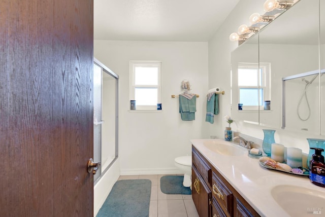 954 Coventry Ln, Fairfield, CA 94533 - bathroom with plenty of natural light, tile patterned floors, toilet, and double vanity