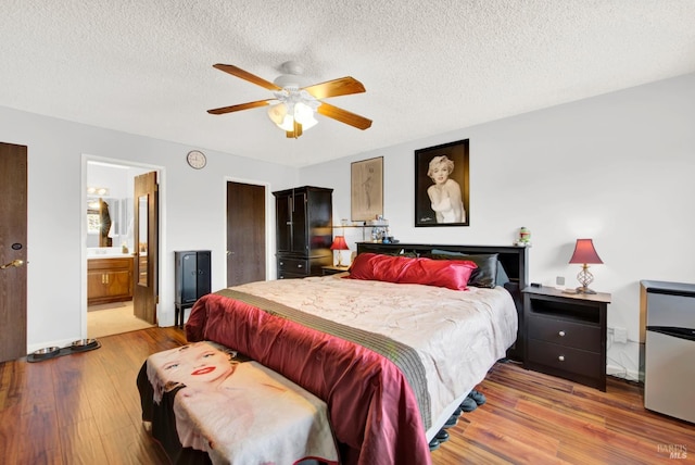 954 Coventry Ln, Fairfield, CA 94533 - bedroom featuring wood finished floors, a textured ceiling, ensuite bathroom, and a ceiling fan