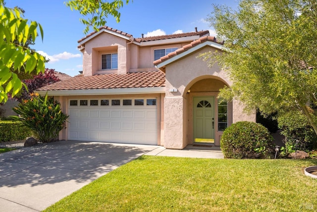 mediterranean / spanish home with a tiled roof, concrete driveway, stucco siding, and a front yard